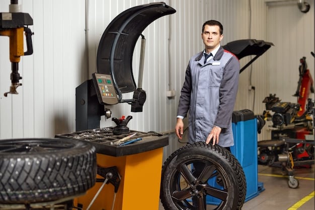 A mechanic inspecting the tires and suspension system of a car. The background shows a well-maintained garage with various tools and equipment.