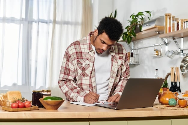 A person sitting at their kitchen table using a laptop to browse the ACA Marketplace website, with a calendar and stack of bills nearby.