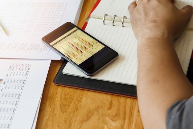 A person using a budgeting app on their smartphone, with charts showing income and expenses. The app interface visually highlights automated savings transfers into an emergency fund.