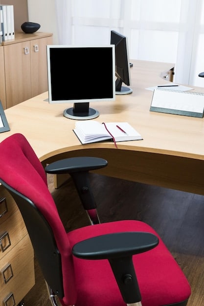 An interior shot of a meticulously organized home office, complete with ergonomic chair, dual monitors, and filing cabinets. The dedicated and uncluttered space underscores the concept of exclusive use for business activities.