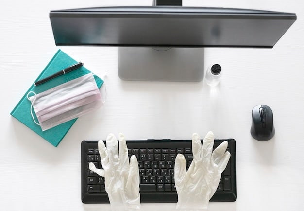 A close-up of ergonomic office accessories including a wrist rest for a keyboard, an ergonomic mouse, and a monitor stand, set up on a clean, modern desk.