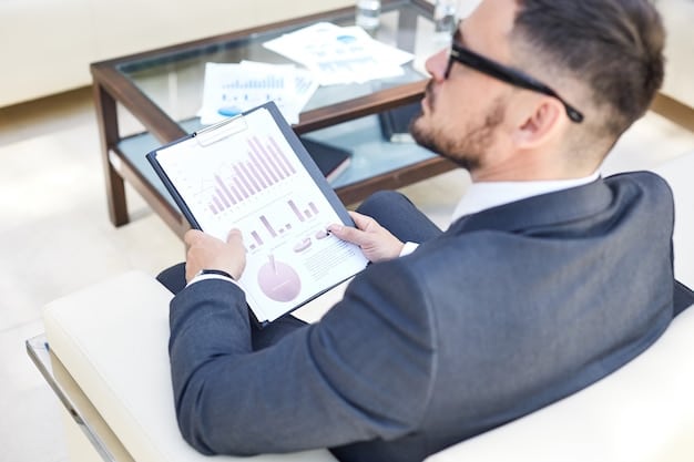 A professional using a tablet to analyze REIT investment data, with charts and graphs displaying financial performance metrics on the screen. The setting is a modern office environment, emphasizing the analytical aspect of REIT investing.