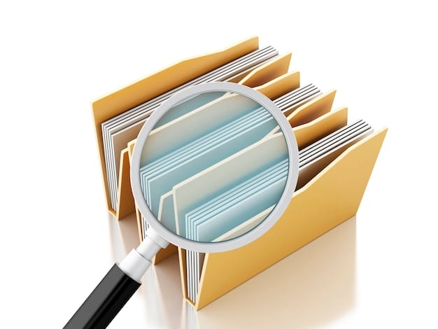 A visual representation of regulatory documents stacked with a magnifying glass hovering over them. The image should convey thoroughness and the importance of detailed examination of regulations within the fintech sector. The documents are stylized with digital icons representing data privacy, cybersecurity, and financial compliance.