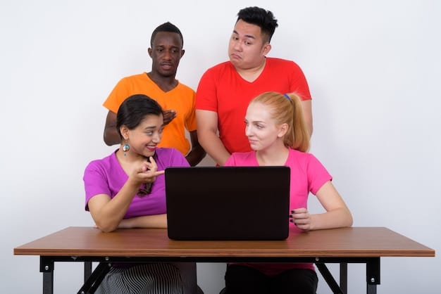 A diverse group of young adults is gathered around a large table, collaborating on laptops and tablets. They are brainstorming ideas, using sticky notes and markers on a whiteboard covered with charts and demographic data. The atmosphere is collaborative and focused on understanding their target audience.